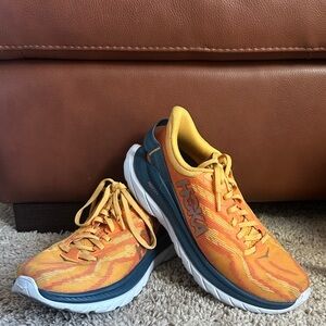Hoka Vibrant Orange and Teal Athletic Shoes